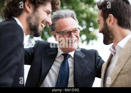 Senior male with his two grown-up sons Stock Photo