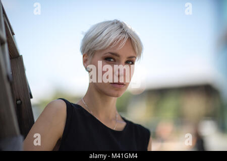 Portrait of woman in city Stock Photo