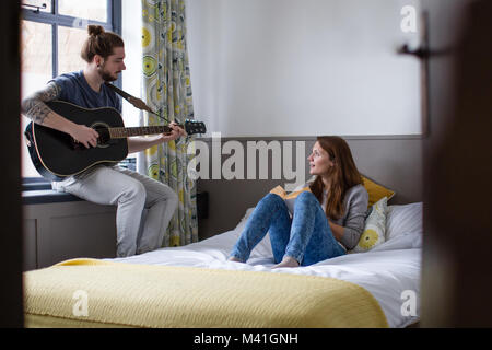 Young couple relaxing at home Stock Photo