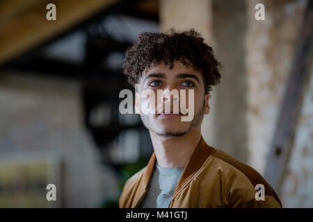Multiracial young adult male looking to future Stock Photo