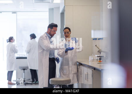 Female student scientist working on an experiment Stock Photo