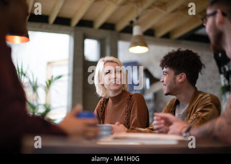Group of young entrepreneurs in a meeting Stock Photo