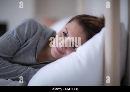 Young adult female waking up in the morning Stock Photo