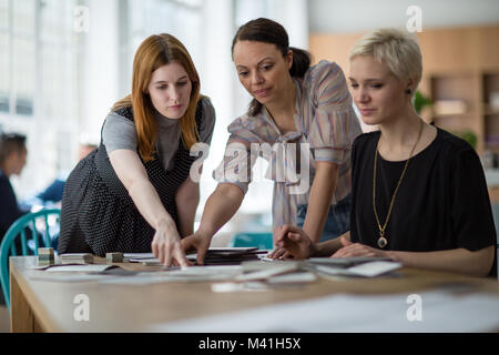 Female coworkers working on a project Stock Photo