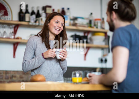 Young couple enjoying breakfast together Stock Photo