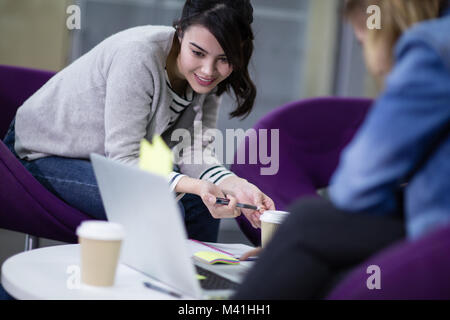 Female students working together Stock Photo