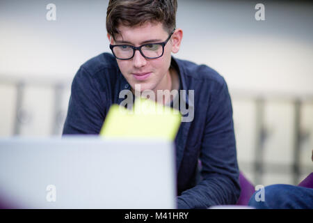Student revising at college Stock Photo
