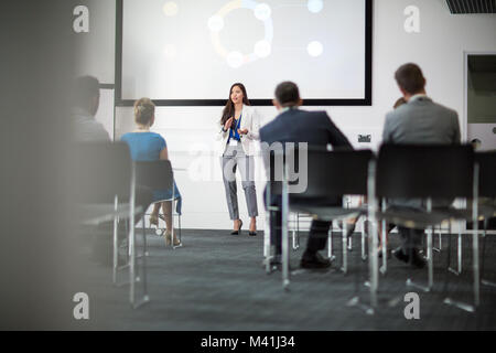 Female executive leading a training conference Stock Photo