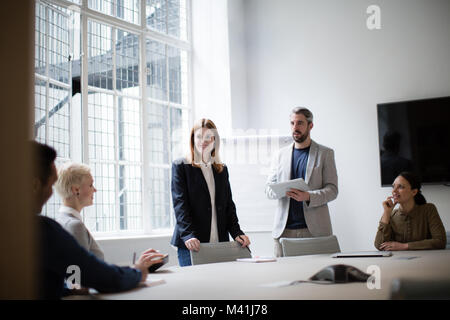 Business executives leading a brainstorm meeting Stock Photo