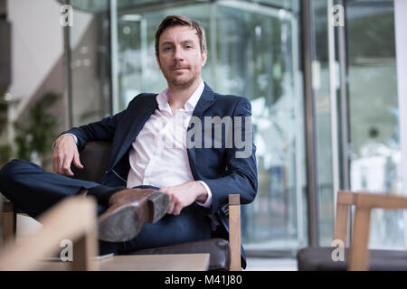 Businessman looking confidently to camera Stock Photo