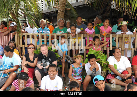 Tuvaluans and tourists watch the parade through Funafuti during annual Independance Day celebrations Stock Photo