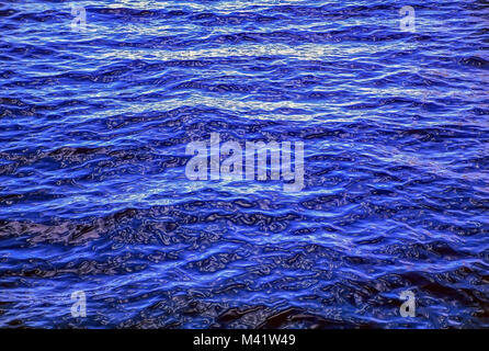 Background - Undulating, blue wavelets of open ocean water. Stock Photo