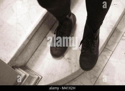 black boots on marble stairs Stock Photo