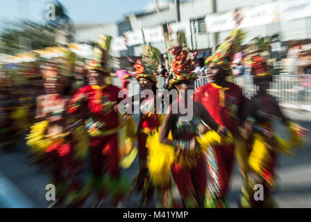 Zoom blur effect photo of happy dancers in bright costumes at the Barranquilla Carnival in Colombia Stock Photo