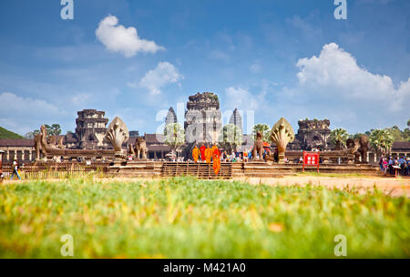 ANGKOR WAT, CAMBODIA - NOV 20, 2013. Buddhist monks in Angkor Wat on Nov 20, 2013, Cambodia. Angkor Wat was first a Hindu, then subsequently, a Buddhi Stock Photo