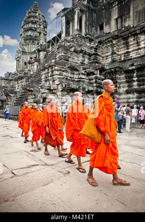 ANGKOR WAT, CAMBODIA - NOV  20,2013: Buddhist monks in Angkor Wat complex on Nov 20, 2013.Cambodia. Angkor Wat was first a Hindu, then subsequently, a Stock Photo