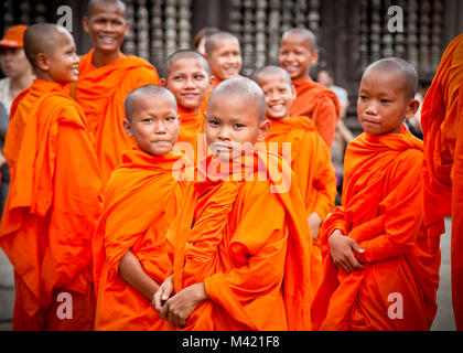 ANGKOR WAT, CAMBODIA - NOV  20,2013: Buddhist monks in Angkor Wat complex on Nov 20, 2013.Cambodia. Angkor Wat was first a Hindu, then subsequently, a Stock Photo