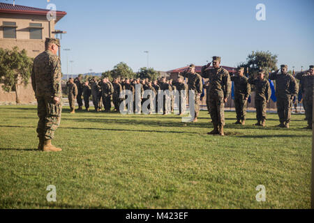 U.S. Marines with 1st Marine Logistics Group salute Brig. Gen. Stephen Sklenka, the commanding general of the 1st MLG, during a quarterly awards ceremony at Camp Pendleton, Calif., Feb. 8, 2018. The awards are given to the Marines and Sailors to recognize the accomplishments achieved by individuals in their respective job fields. (U.S. Marine Corps photo by Cpl. Adam Dublinske) Stock Photo