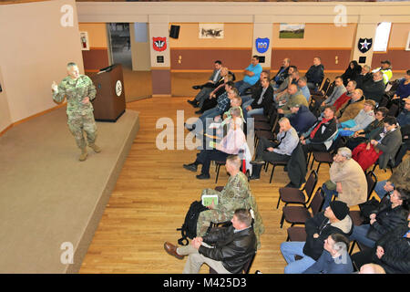 Garrison Commander Col. David J. Pinter Sr. provides his annual briefing to the Fort McCoy workforce Jan. 24, 2018, in building 905 at Fort McCoy, Wis. Pinter held two workforce briefings to hundreds of Fort McCoy employees where he discussed many plans, programs, and future efforts at the installation. (U.S. Army Photo by Scott T. Sturkol, Public Affairs Office, Fort McCoy, Wis.) Stock Photo