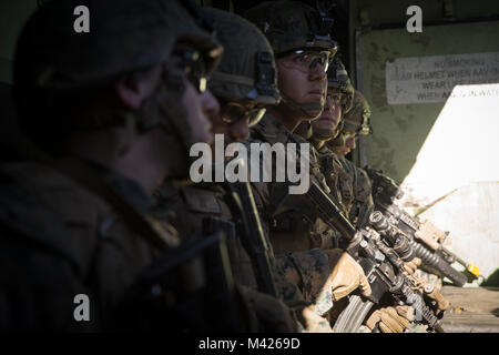 U.S. Marines with Kilo Company, Battalion Landing Team (BLT), 3rd Battalion, 1st Marine Regiment prepare for an assault exercise on Camp Pendleton, California, Jan. 31, 2018. BLT 3/1 is refining tactics, techniques, and procedures applicable to raid operations in order to enhance their ability to conduct expeditionary operations while deployed. (U.S. Marine Corps photo by Cpl. Danny Gonzalez) Stock Photo