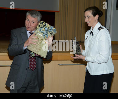 Brig. Gen. (Ret) William T. Bester, guest speaker at the Army Nurse Corps, 117th Birthday celebration, receives tokens of appreciation from Col. Michelle L. Munroe, Chief of Nursing, February 02, 2018, Landstuhl Regional Medical Center, Landstuhl, Germany. (U.S. Army photo by Visual Information Specialist Elisabeth Paque/Released) Stock Photo