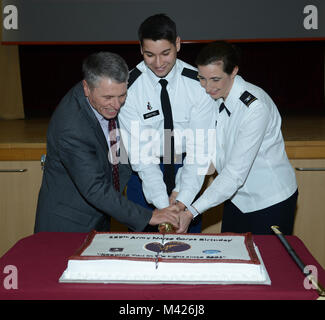 Brig. Gen. (Ret) William T. Bester, 2nd Lt. Addison Montiel, junior Army Nurse Officer and Col. Michelle L. Munroe, Chief of Nursing, cutting the cake at the  Army Nurse Corps, 117th Birthday celebration, February 02, 2018, Landstuhl Regional Medical Center, Landstuhl, Germany. (U.S. Army photo by Visual Information Specialist Elisabeth Paque/Released) Stock Photo