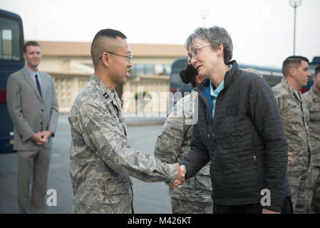 Secretary of the Air Force Heather Wilson coins Capt. Kevin Liu, 961st Airborne Air Control Squadron project officer, Feb. 2, 2018, at Kadena Air Base, Japan. Challenge coins are a military tradition in which a senior military leader or a member of a distinguished office acknowledges the awards, accomplishments or significant acts of a particular service member. (U.S. Air Force photo by Senior Airman Quay Drawdy) Stock Photo