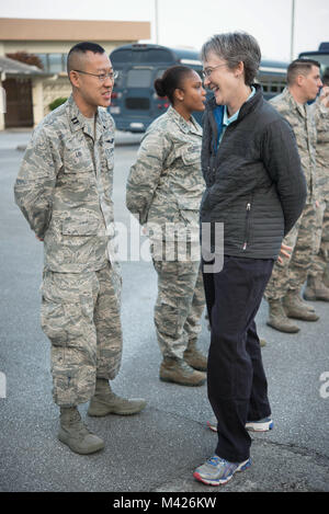 Secretary of the Air Force Heather Wilson speaks with Capt. Kevin Liu, 961st Airborne Air Control Squadron project officer, Feb. 2, 2018, at Kadena Air Base, Japan. During the tour, Wilson reiterated the importance of readiness, modernization and innovation to remain the greatest Air Force in the world. (U.S. Air Force photo by Senior Airman Quay Drawdy) Stock Photo