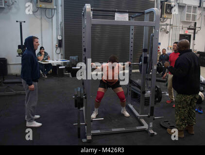 180202-N-GP524-0469  NAVAL SUPPORT FACILITY DEVESELU, Romania (Feb. 2, 2018) Sailors assigned to Naval Support Facility (NSF) Deveselu compete in a 1000-pound weightlifting challenge hosted by the command Morale, Welfare and Recreation team. NSF Deveselu and Aegis Ashore Missile Defense System Romania are co-located with the Romanian 99th Military Base and play a key role in ballistic missile defense in Eastern Europe. (U.S. Navy photo by Mass Communication Specialist 2nd Class Bill Dodge/Released) Stock Photo
