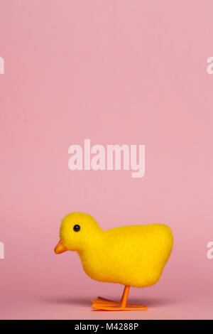 Easter chick on a pastel pink background Stock Photo