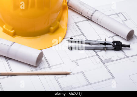 High Angle View Of Tools With Hardhat On Blueprint Stock Photo