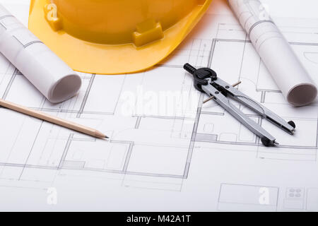 High Angle View Of Tools With Hardhat On Blueprint Stock Photo