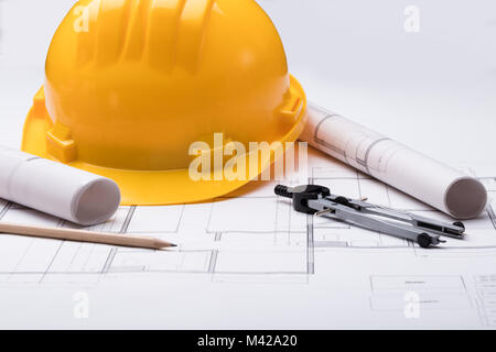 High Angle View Of Tools With Hardhat On Blueprint Stock Photo