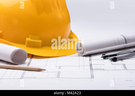 High Angle View Of Tools With Hardhat On Blueprint Stock Photo