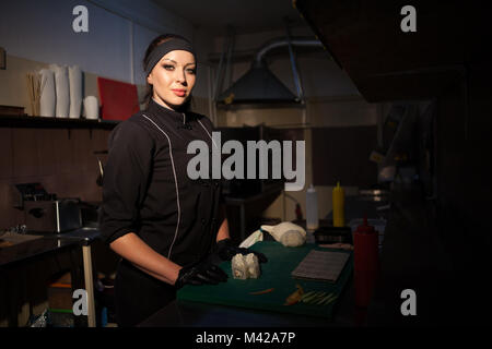 a girl prepares food sushi Bistro nice Stock Photo