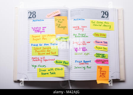 High Angle View Of Open Diary With Notes Stock Photo