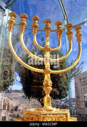 The Temple Institute gold menorah stands under plexiglass in the Jewish Quarter of Jerusalem's Old City. Stock Photo