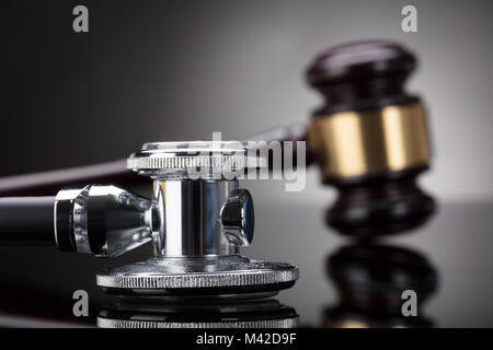 Close-up Of A Stethoscope In Front Of Gavel Stock Photo