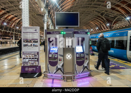A ticket machine on the platform at Paddiington Railway Station where passengers can buy tickets to travel on The Heathrow Express. Stock Photo