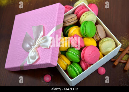 Colorful French or Italian macaron stack on wood table with copy space for background. Macarons or macaroons is French dessert for served with afterno Stock Photo