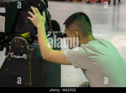 Airman 1st Class Shu Hsu, 18th Component Maintenance Squadron egress systems journeyman, performs a visual inspection on an F-15 Eagle ejection seat Feb. 7, 2018, at Kadena Air Base, Japan. Hsu enjoys the specialization of his job and takes great pride in practicing excellence with his tasks. (U.S. Air Force Stock Photo