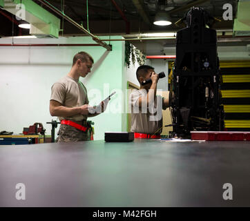 Airmen from the 18th Component Maintenance Squadron egress shop perform a visual inspection of an ejection seat Feb. 7, 2018, at Kadena Air Base, Japan. Egress is a specialized career field and requires attention to detail at all times. (U.S. Air Force Stock Photo