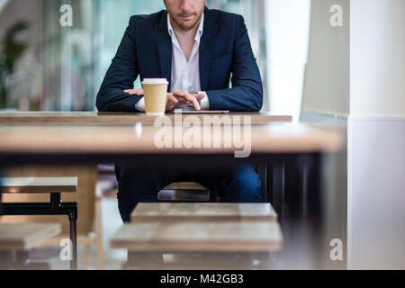 Close-up of businessman using a digital tablet Stock Photo