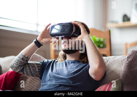 Young adult male using VR headset Stock Photo