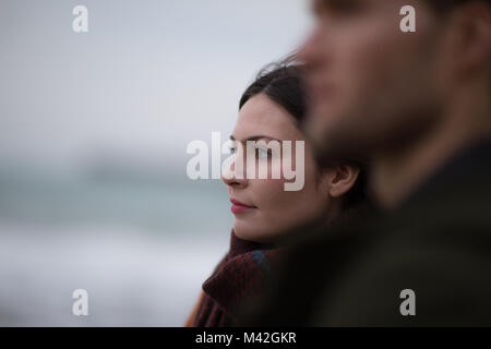 Young adult female on winter beach Stock Photo