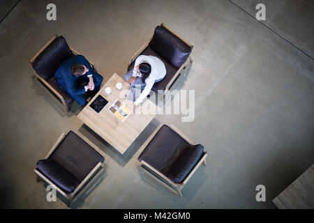 Overhead shot of colleagues waiting for clients Stock Photo