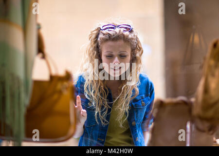 Young female window shopping Stock Photo