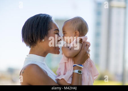 Mum and new baby in city Stock Photo