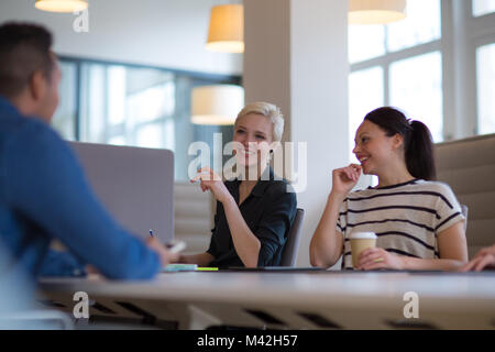 Business colleagues in a morning meeting with coffee Stock Photo