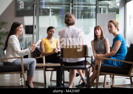 Group of businesswomen in a meeting Stock Photo